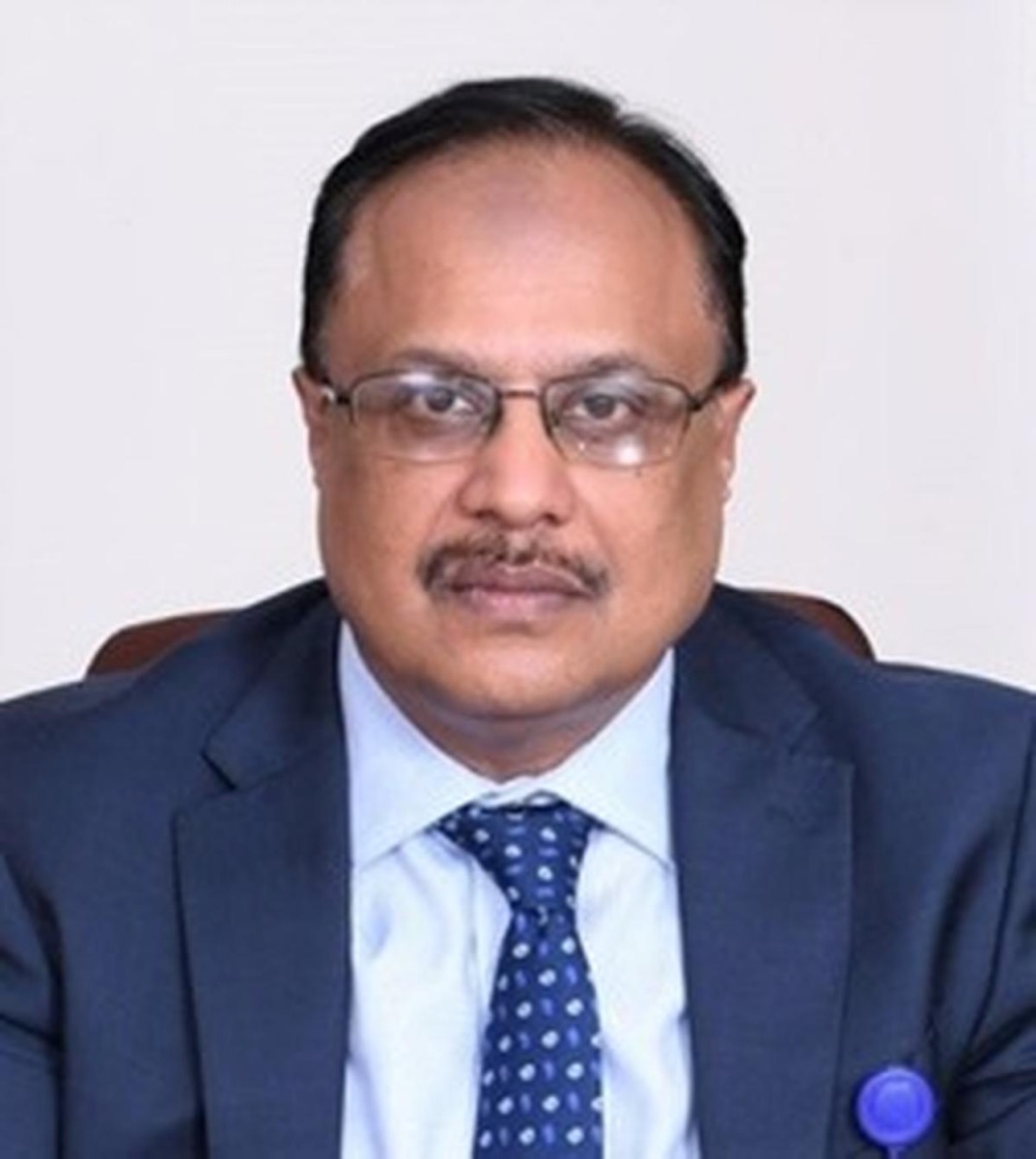 Ramakrishnan Chander, Managing Director of Life Insurance Corporation of India, in a dark suit and patterned tie against a plain light background.